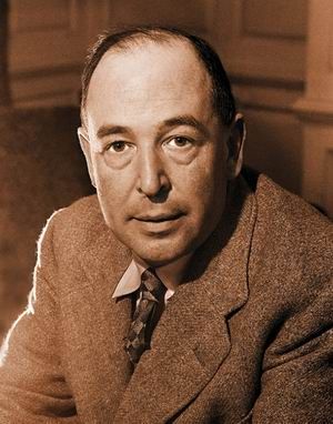 Sepia coloured photograph (bust) of the late author, C S Lewis, here a middle aged man with dark, thinning hair wearing a thick jacket and checked tie.