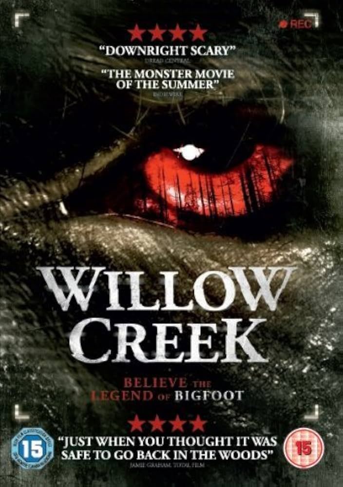 DVD cover of 'Willow Creek', featuring a close up of an ape-like face with a red eye; tree trunks visible in the iris.
