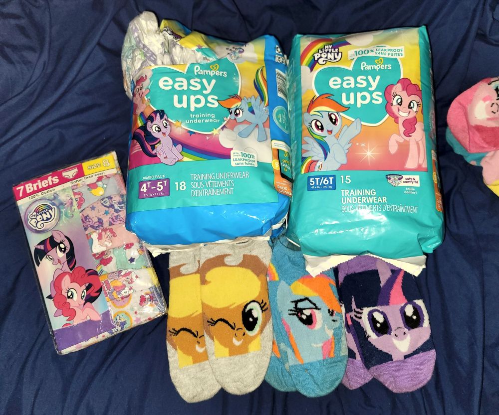 collection of mlp themed diapers, underwear, and some socks