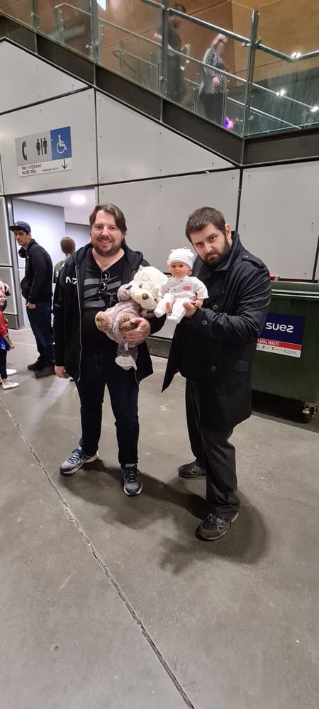 Picture of two men going to a comic convention, one is dressed as Billy butcher from the boys.