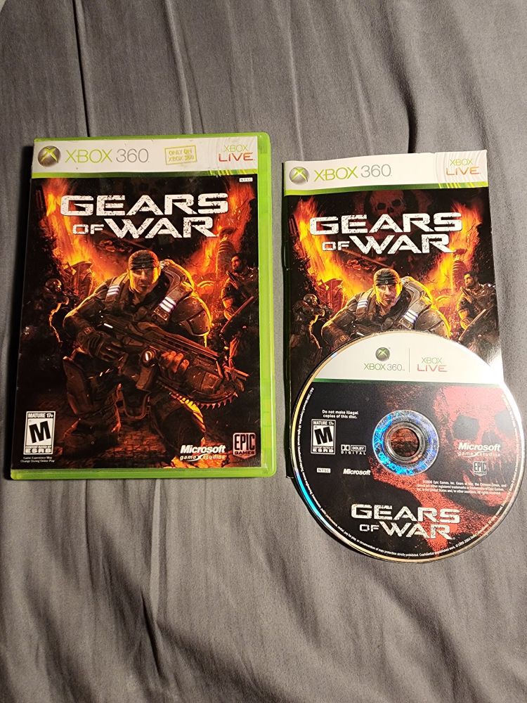 Box, booklet, and disc of Gears of War for the Xbox 360.