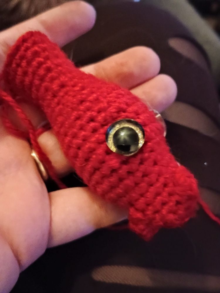 Crocheted red dragon head