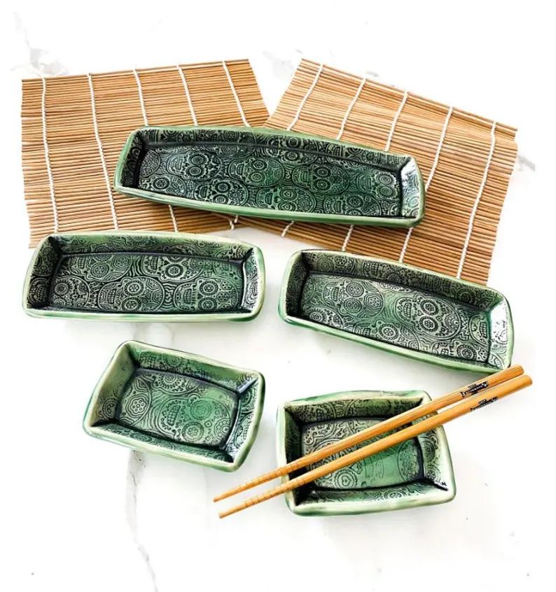A five piece stoneware sushi set. 