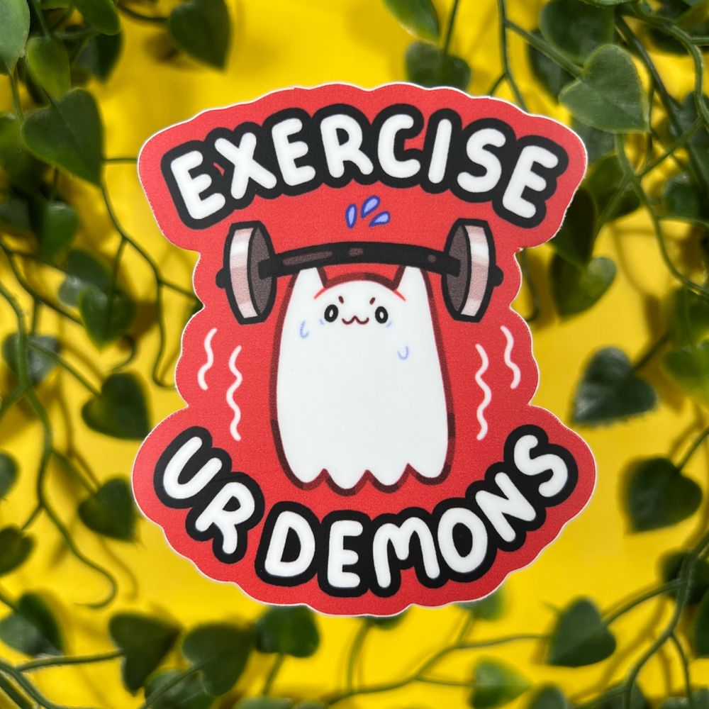A sticker of a ghost that says “exercise your demons”