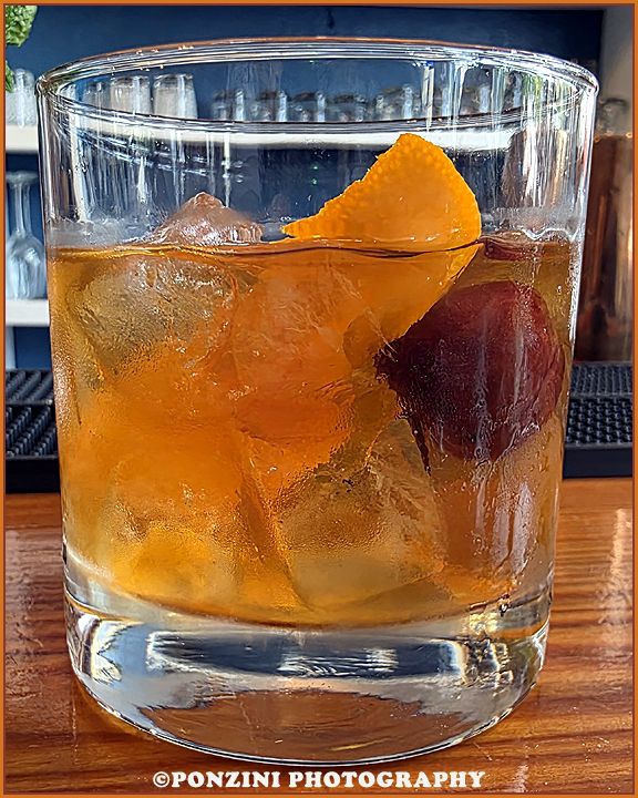 A Rum Old Fashioned sits on the bar at Outer Banks Disatilling.