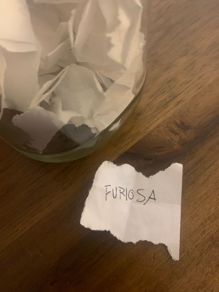 A scap of paper that reads "Furiosa" next to the Movie Jar