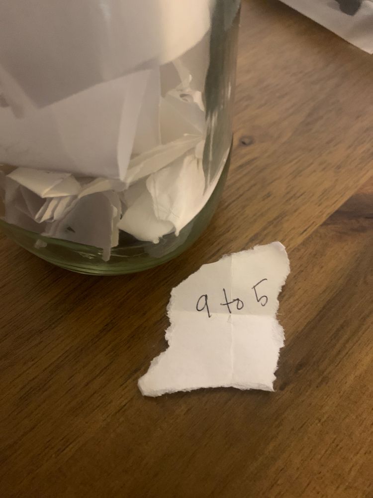A scrap of paper that reads "9 to 5"