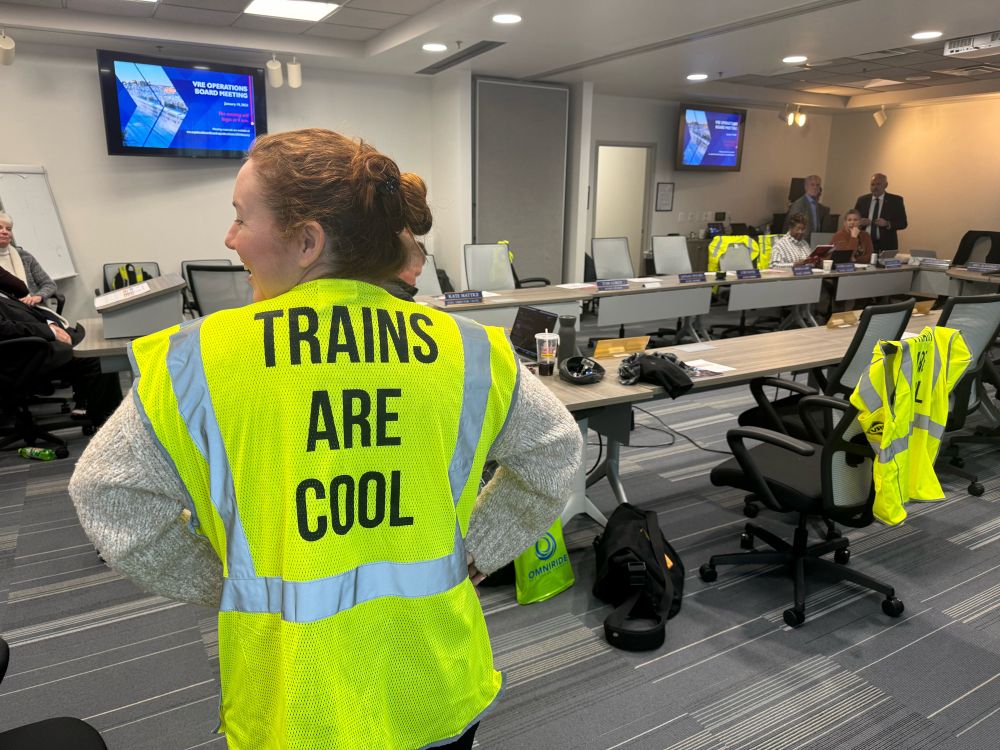 A high viz vest worn with panache with the true statement that Trains Are Cool.