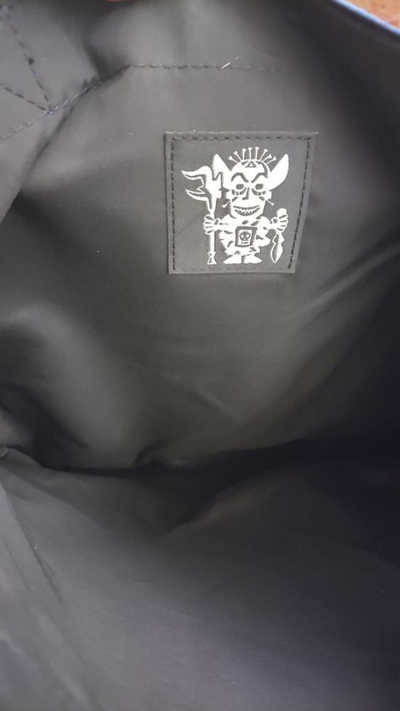 Interior of tote bag, solid black with white Shiriki Utundu graphic