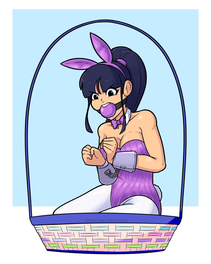 Cecily sits in an Easter themed basket, in a purple bunny suit and white leggings.  Her wrists are cuffed in front of her with a thick set of cuffs while a large purple ballgag keeps her from complaining too much