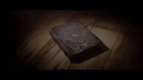 Story book on wooden floor flipping through its own pages
