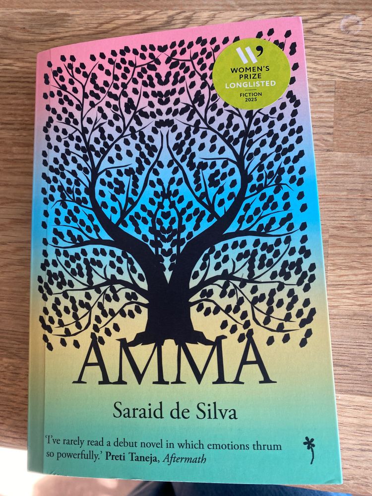 Amma by Saraid de Silva- book cover with tree silhouette. 
