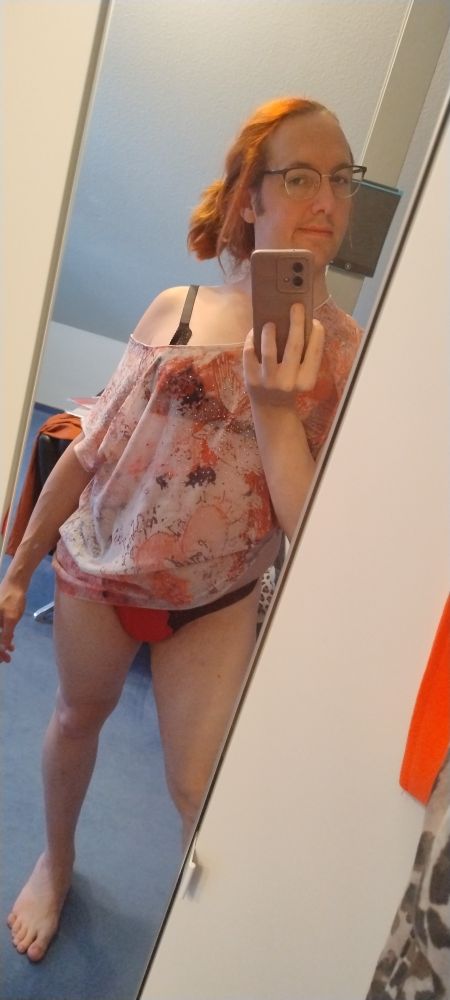 Mirrorselfie in a transparent overzised top black lace bra and red thong with black lace. i have kinda morning Hair with some loose Strands Off my ponytail.