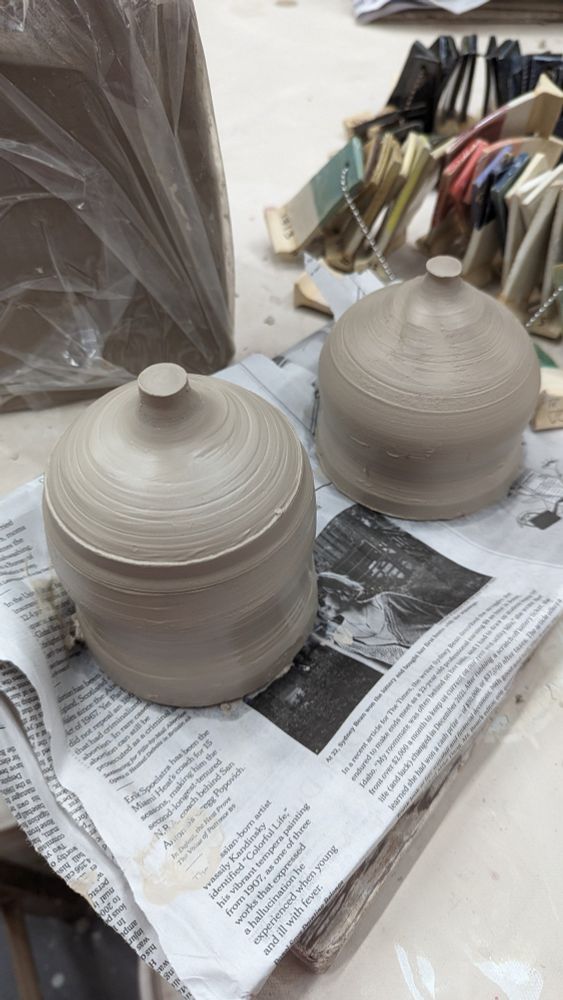 Two freshly hand-thrown closed form pottery pieces 