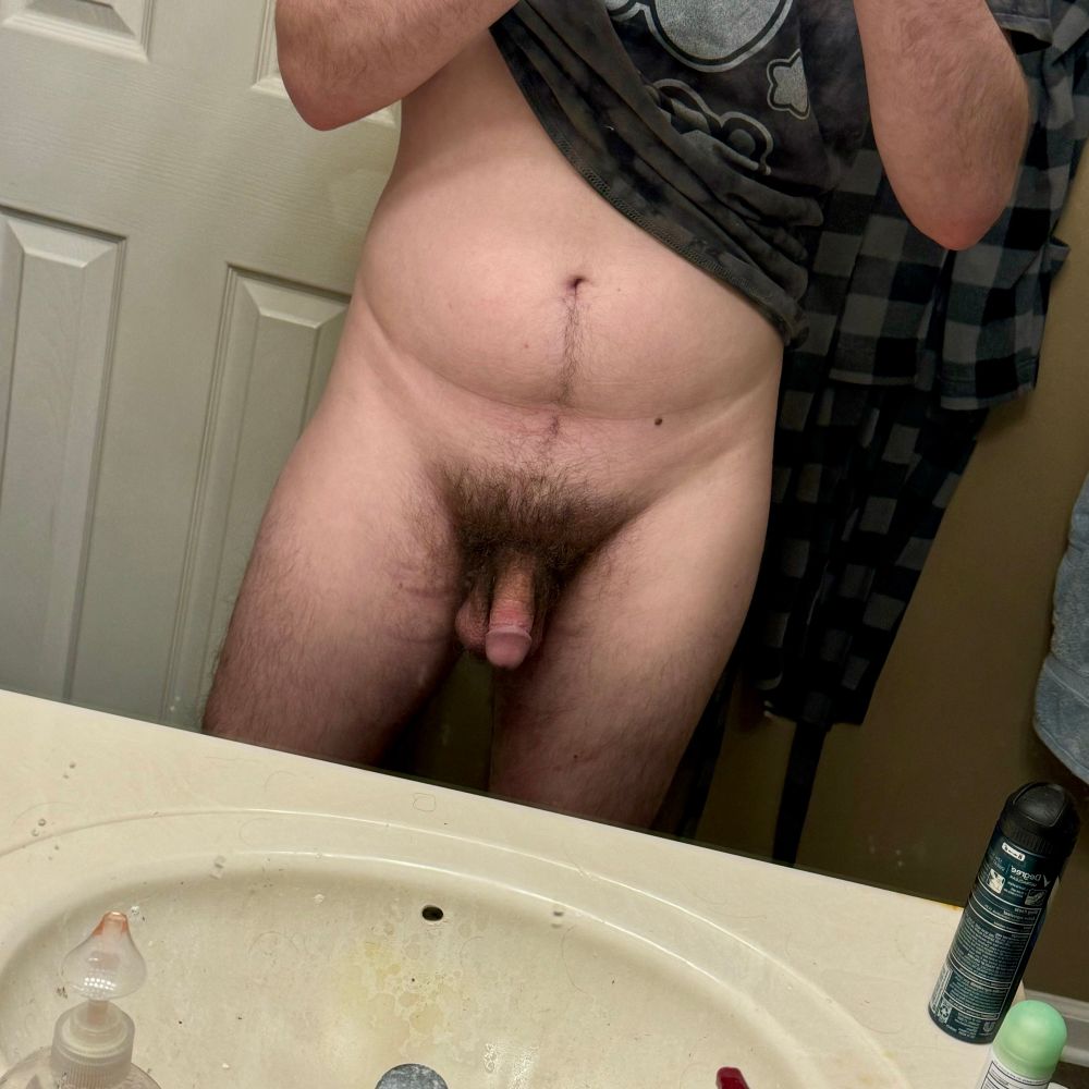 Photo of me in the mirror. You just see my tummy crotch and thighs, and I have a fairly large bush for my liking 