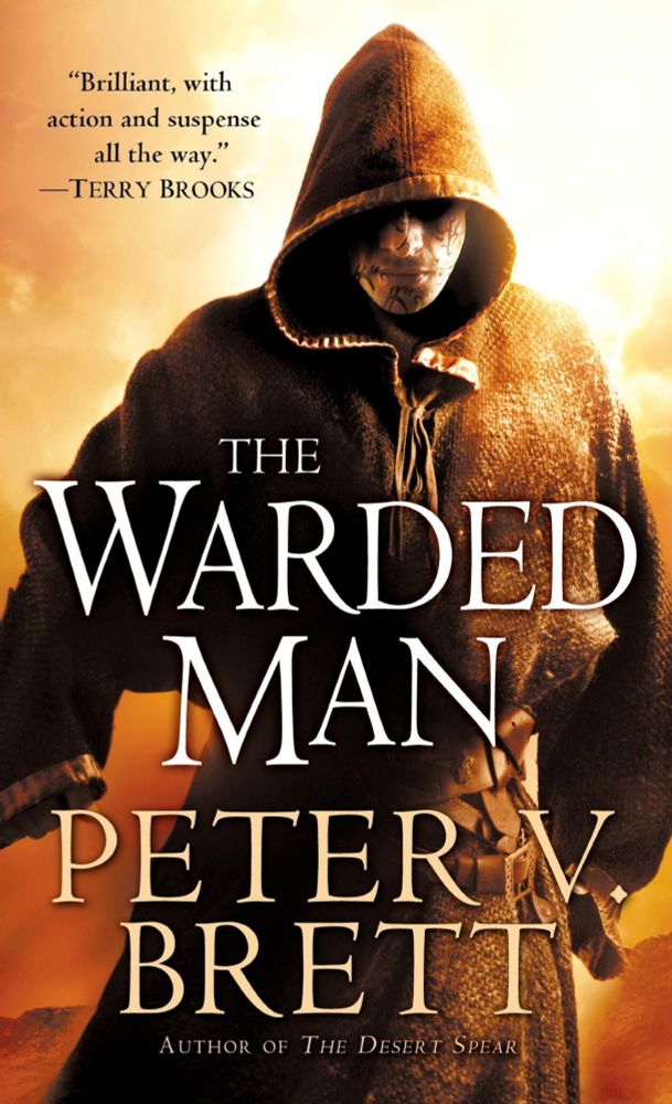 Book cover. The Warded Man by Peter V. Brett (Demon Cycle #1 / 2008) Also titled The Painted Man. Cover shows a man with facial tattoos, wearing a cloak, wandering in the desert.