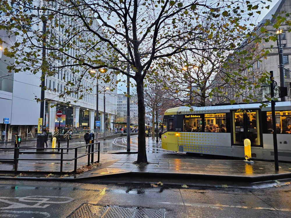 Street of Manchester showing a tram, taken at dusk