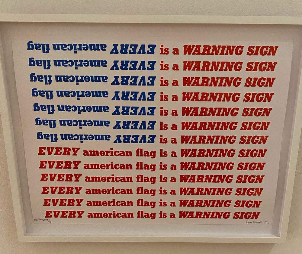 Text shaped like an American flag that reads “every American flag is a warning sign”