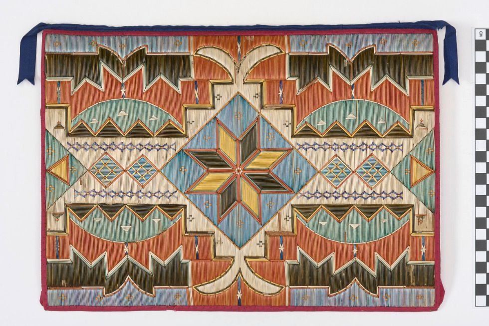 A portfolio case with an ornate design made of porcupine quills, including the traditional Mi’kmaw star design.