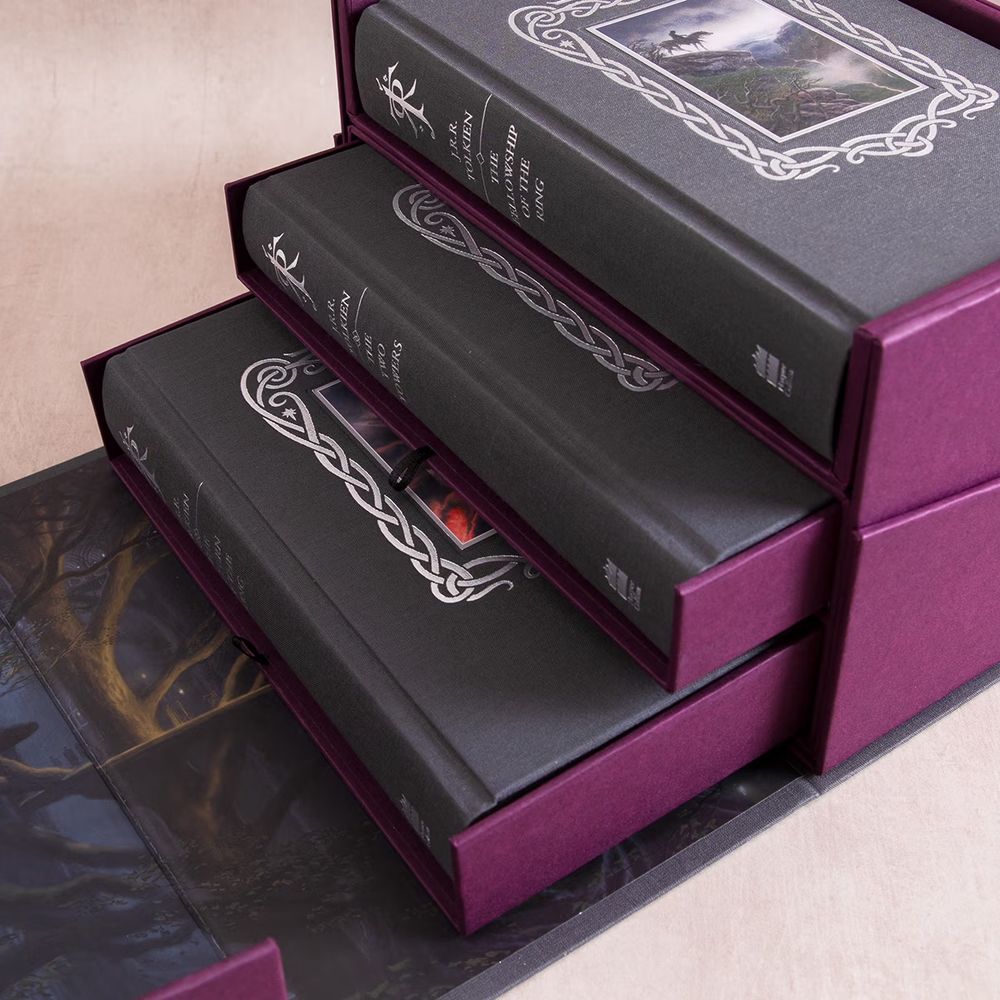 Clamshell Box of 3x Grey Cloth stamped hardbacks in "silver foil & Plum Wibalin" with two removable drawers