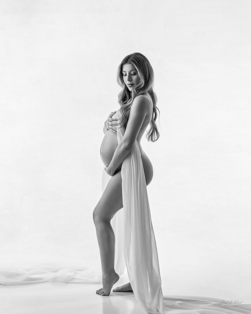 Maternity boudoir portrait highlighting pregnancy glow