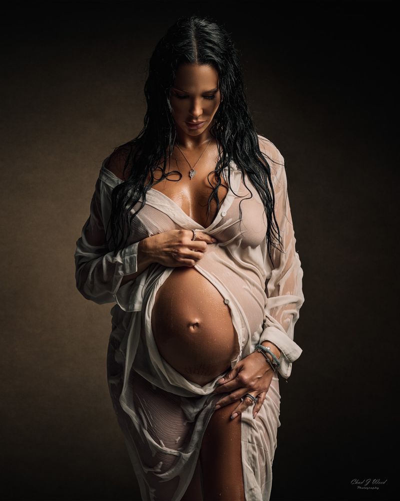Phoenix Maternity Boudoir Photoshoot: Pregnant woman in sensual pose with wet white shirt