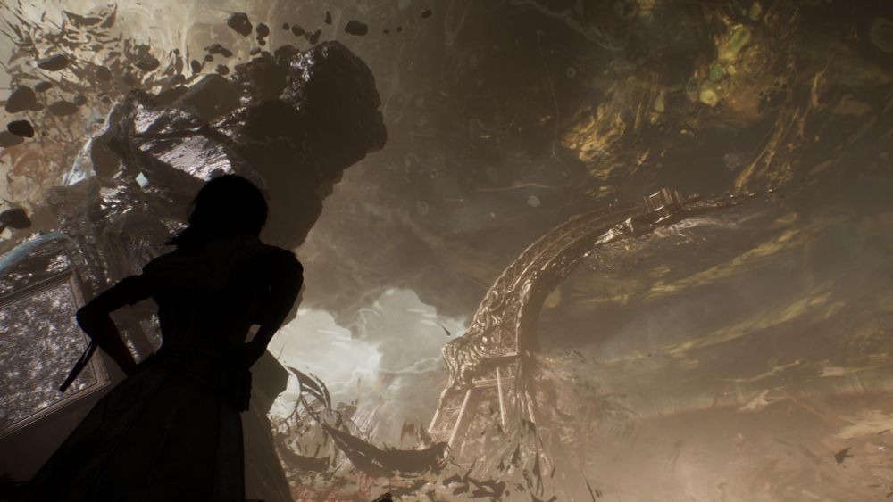 A screenshot from the video game Clair Obscur: Expedition 33, showing a character silhouetted in the foreground, staring at a warped landscape where a twisted Eiffel Tower sits in the distance.