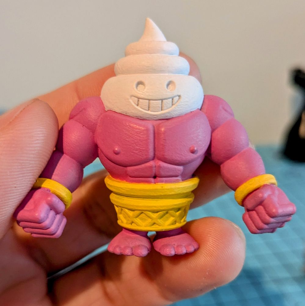 A buff bodybuilder ice cream cone character toy