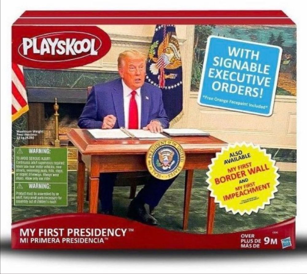 Donald Trump sitting at a table with the Presidential seal