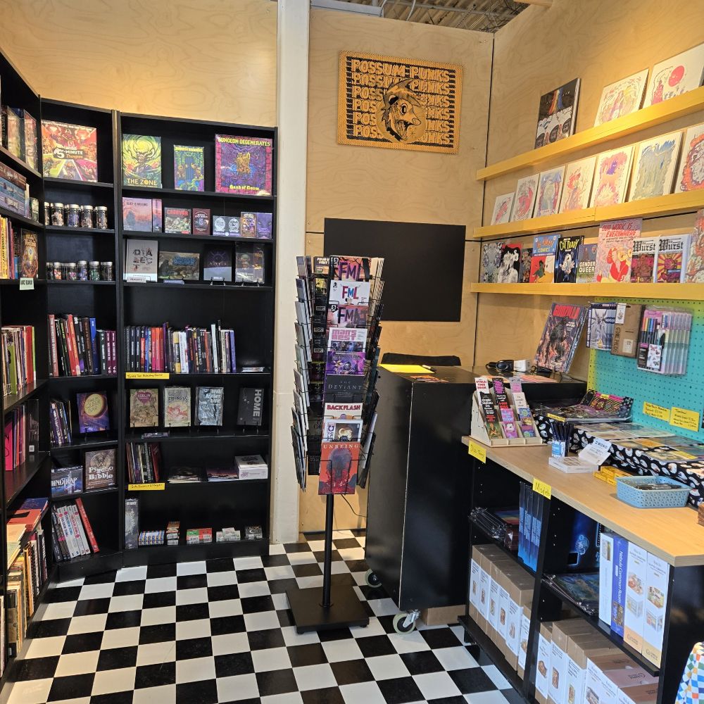 photo of my tiny comic shop with checker flooring