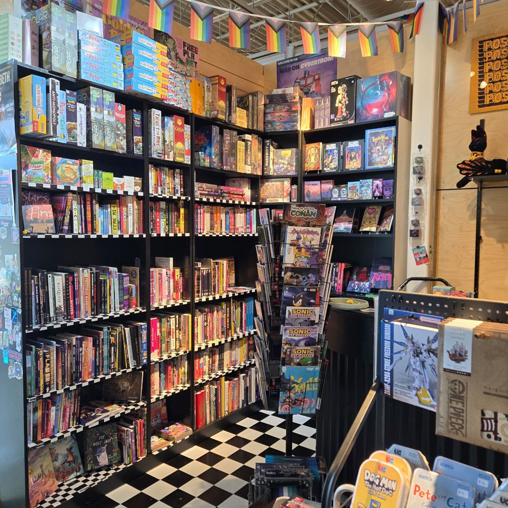 Photo of small comic shop with shelf displays