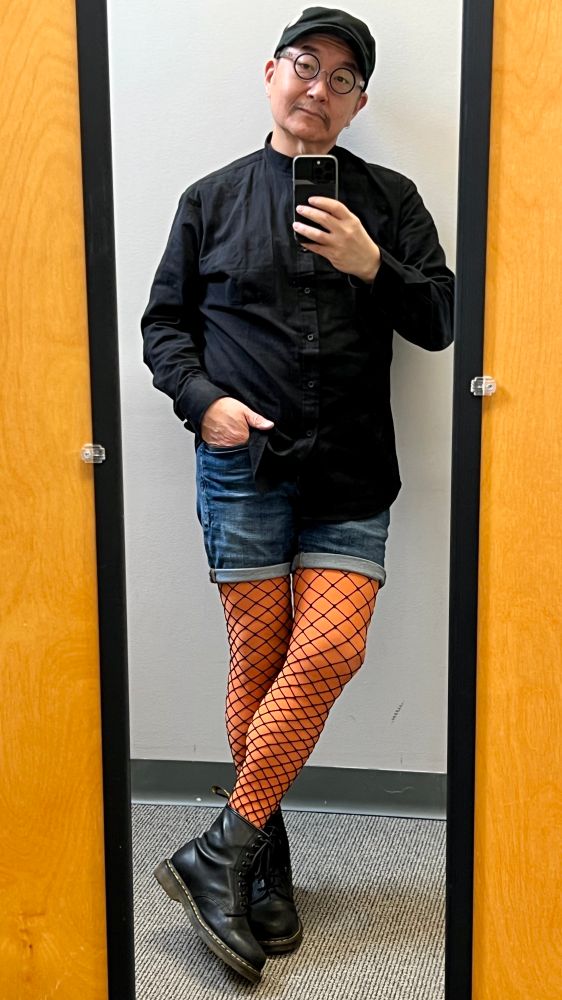 OOTD black button down shirt, blue jean shorts, orange tights with large net fishnets layered on top and some good ole 8-hole DMs. 