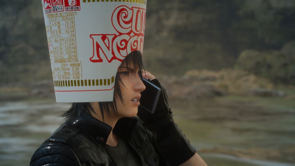 Noctis from Final Fantasy XV taking a tense phone call and wearing a giant Cup Noodle container on his head.