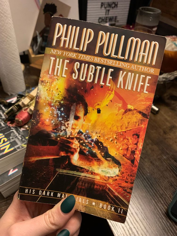 The book The Subtle Knife by Philip Pullman
