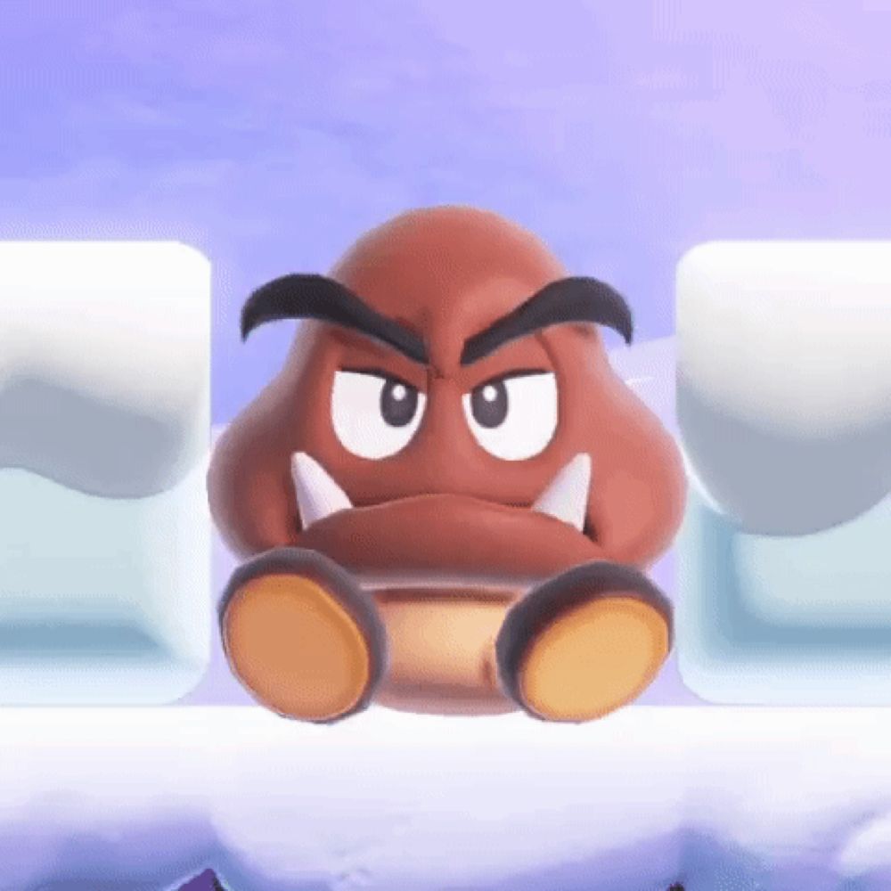 a close up of a cartoon character sitting on top of a snow covered ice block .