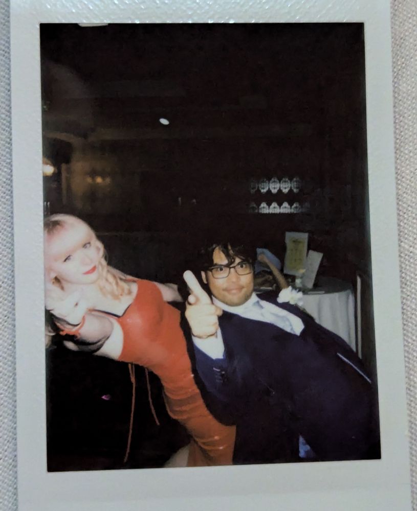 The enemy stand user could be anyone. The enemy stand user hitting a crazy backwards lean and point with their stand behind them hitting the same pose. Oh yeah it's a Polaroid of me and a friend doing that. I hope this alt text was helpful 