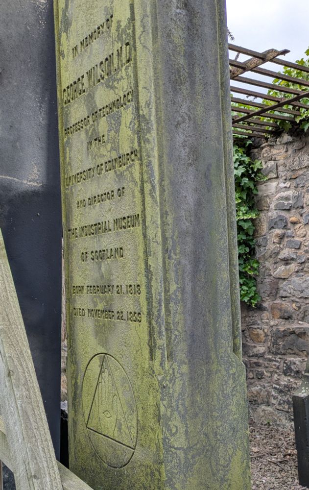 Close up of the inscription to George Wilson, noting that he was founding director etc, with symbol below of an eye in a hand in a triangle in a circle.