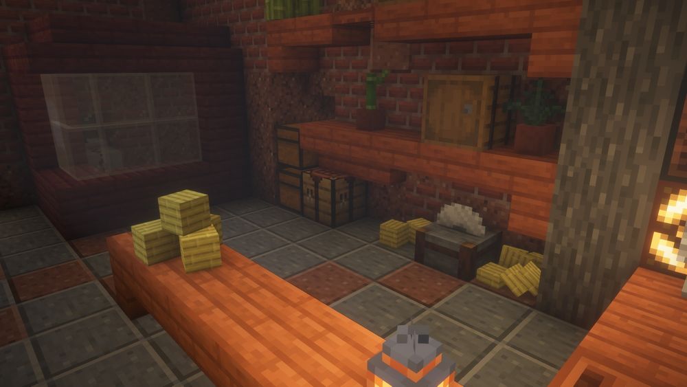 A minecraft build's interior. Shelves flank the back wall with barrels and items on the shelves. The back of this build has a stonecutter, with slabs of bamboo blocks that appear to have come off the stonecutter and are laying on the floor.