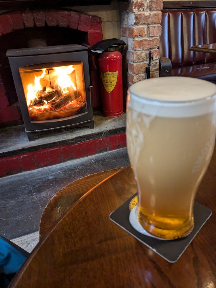Pint of Golden Best in front of a roaring wood stove - Duck & Drake Leeds