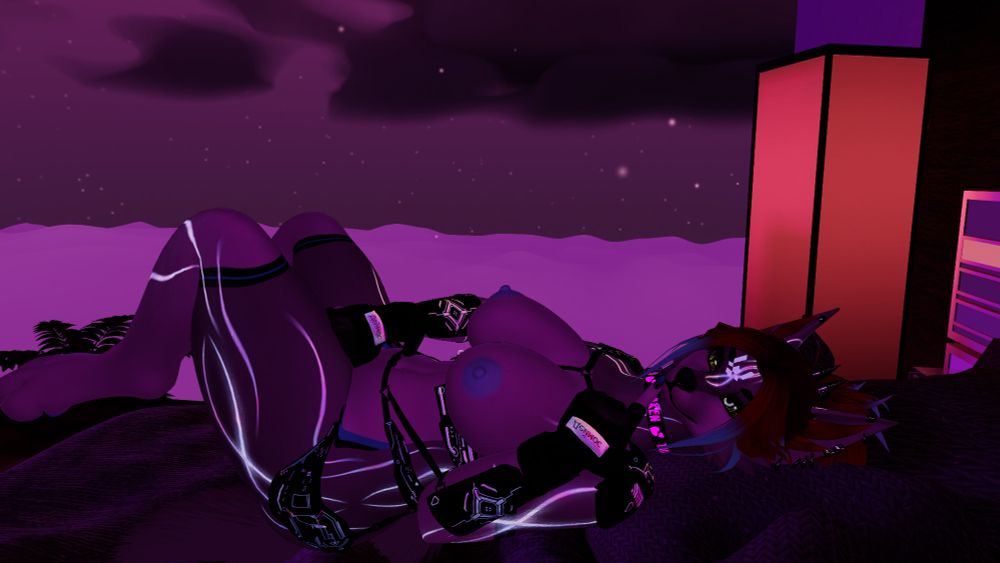 Sasha a grey vixen, sensually posed in bed teasing herself