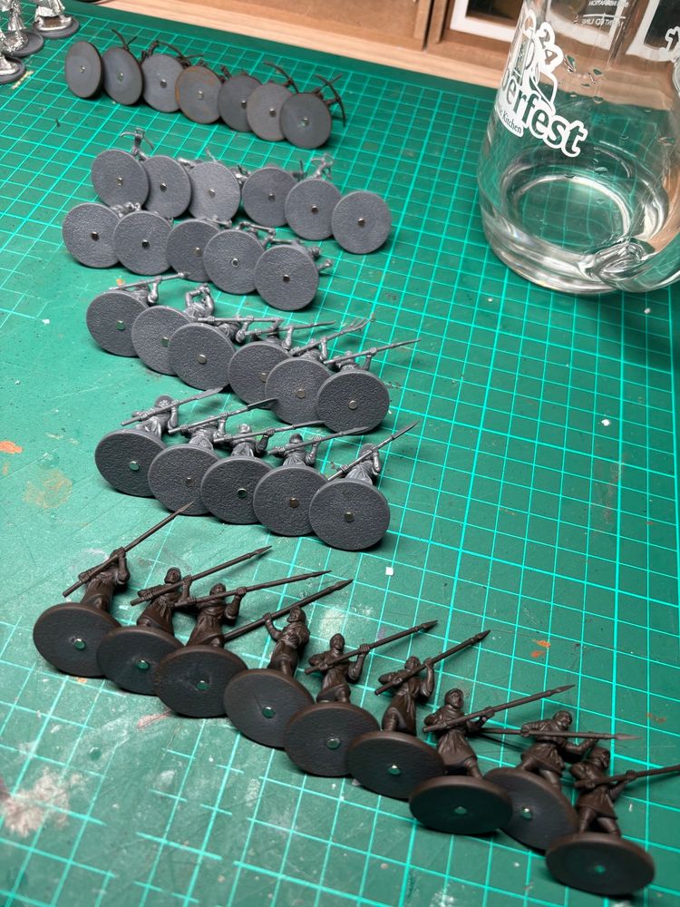 Lots of Barons War plastic miniatures which have had a 3mm x 1mm magnet glued into their bases. Things for easier storage in a tub with a metallic sheet in. 
