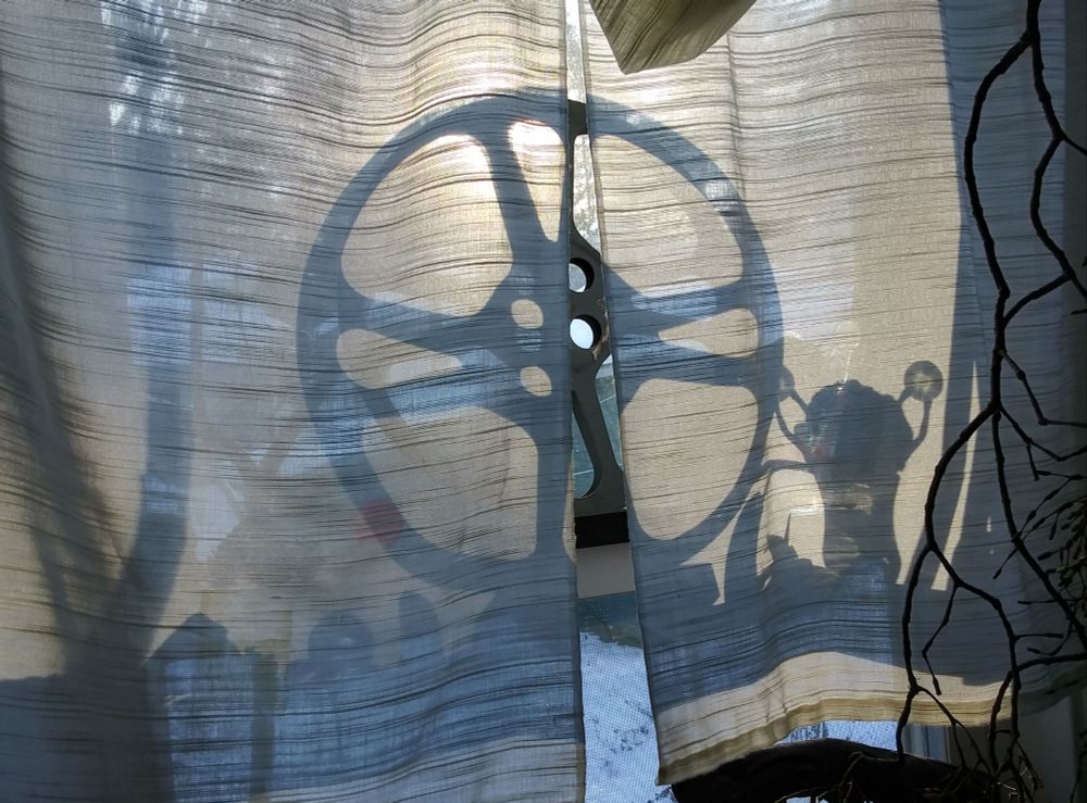 Light and shadows on a semitransparent curtain