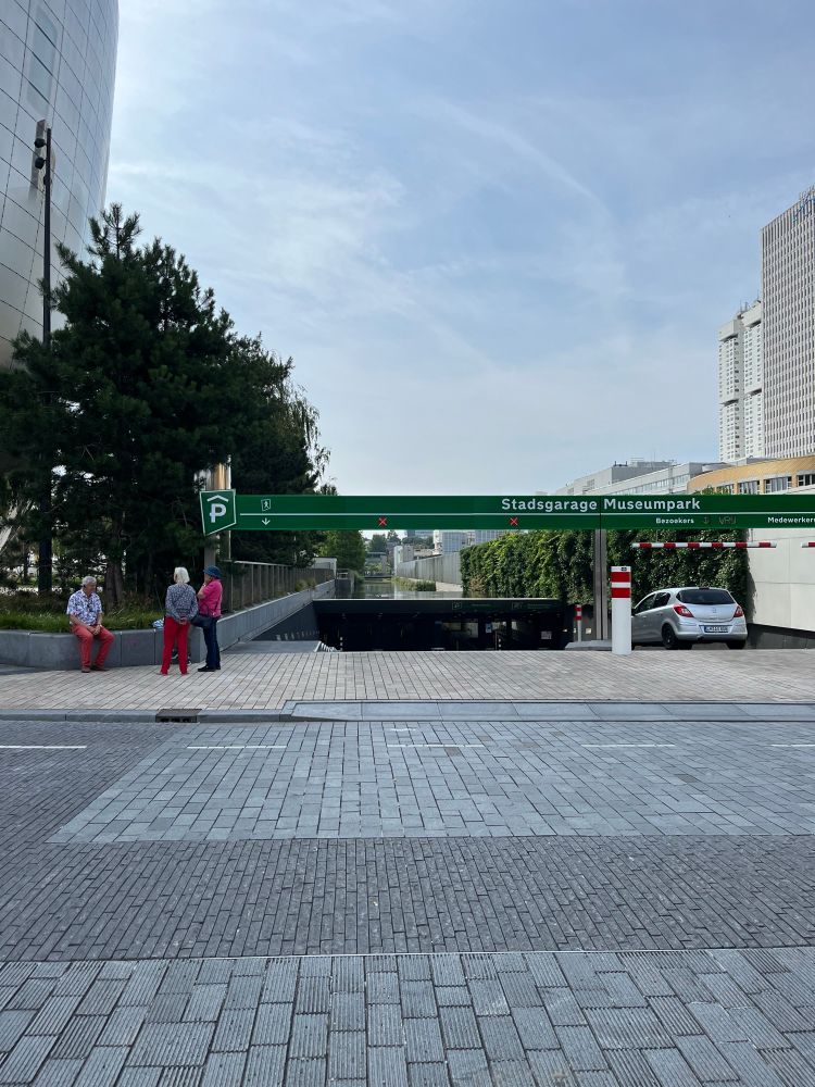 A body of water is shown above the entrance/exit for an underground parking garage