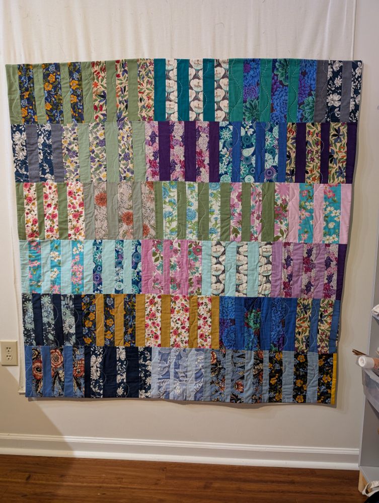 Scrappy quilt. No new fabric purchased. All fabrics are scraps from my stash, swaps, scavenging, or SCRAP Baltimore creative reuse center.
