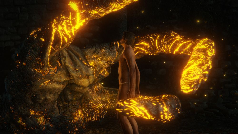 A giant, fiery, three-fingered hand encircles a most-naked player-character in a screenshot of a cutscene from Elden Ring.
