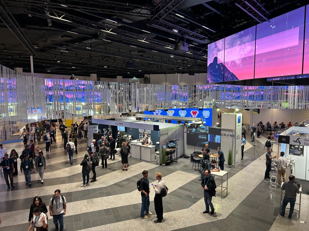 People at a conference with informational booths