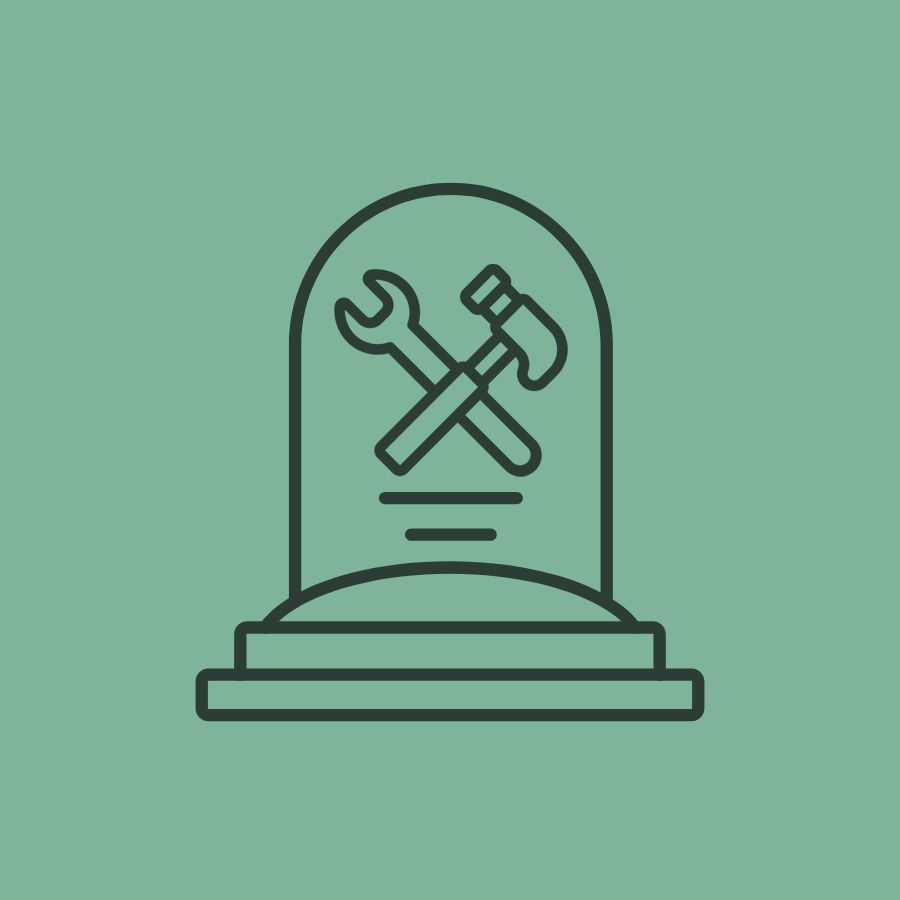Gravestone with tools, symbolizing DIY death care