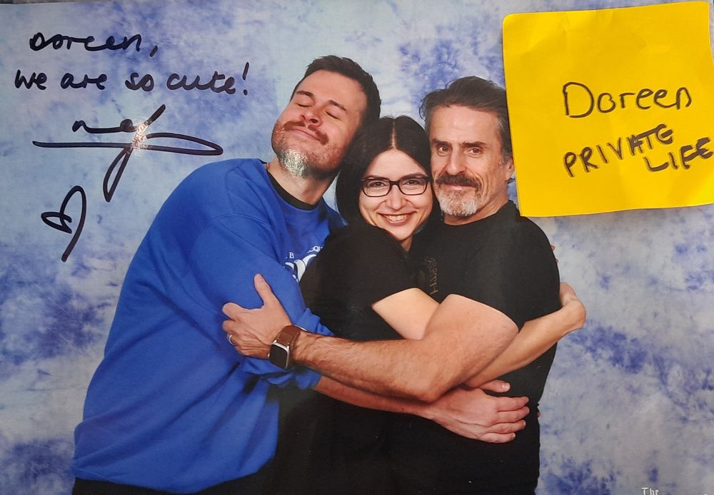 Photo of a fan with the actors Nathan Foad and Con O'Neill from Our Flag Means Death that was signed by Nathan with the quote We are so cute