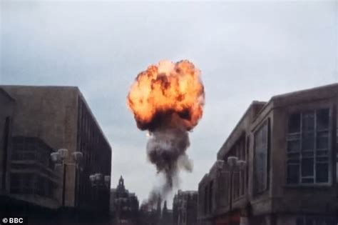 A mushroom cloud appears as a nuclear bomb explodes over Sheffield, in the horrific dystopian Cold War film “Threads”