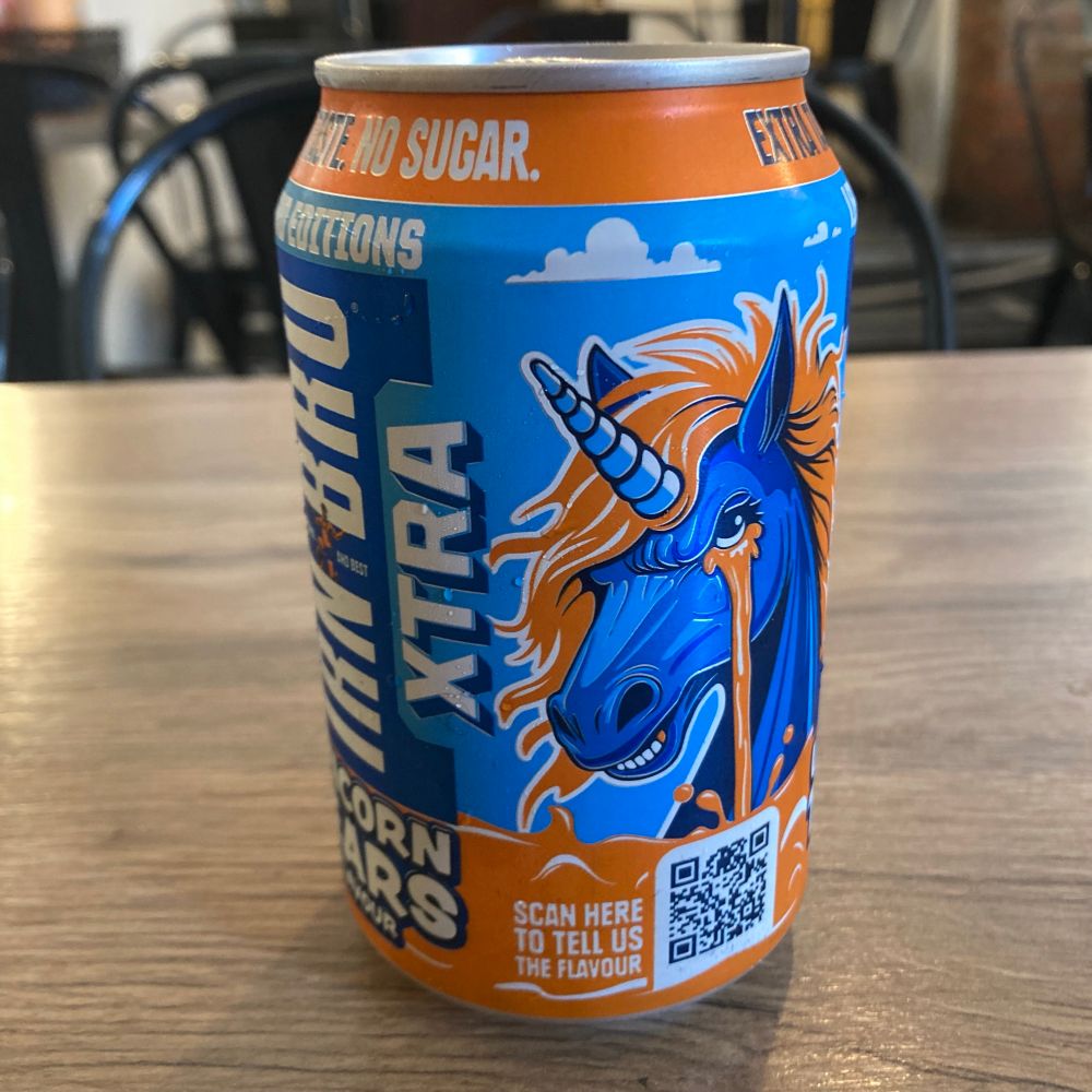 A can of Irn-Bru in its distinctive orange and blue colours, featuring a blue unicorn with an orange mane